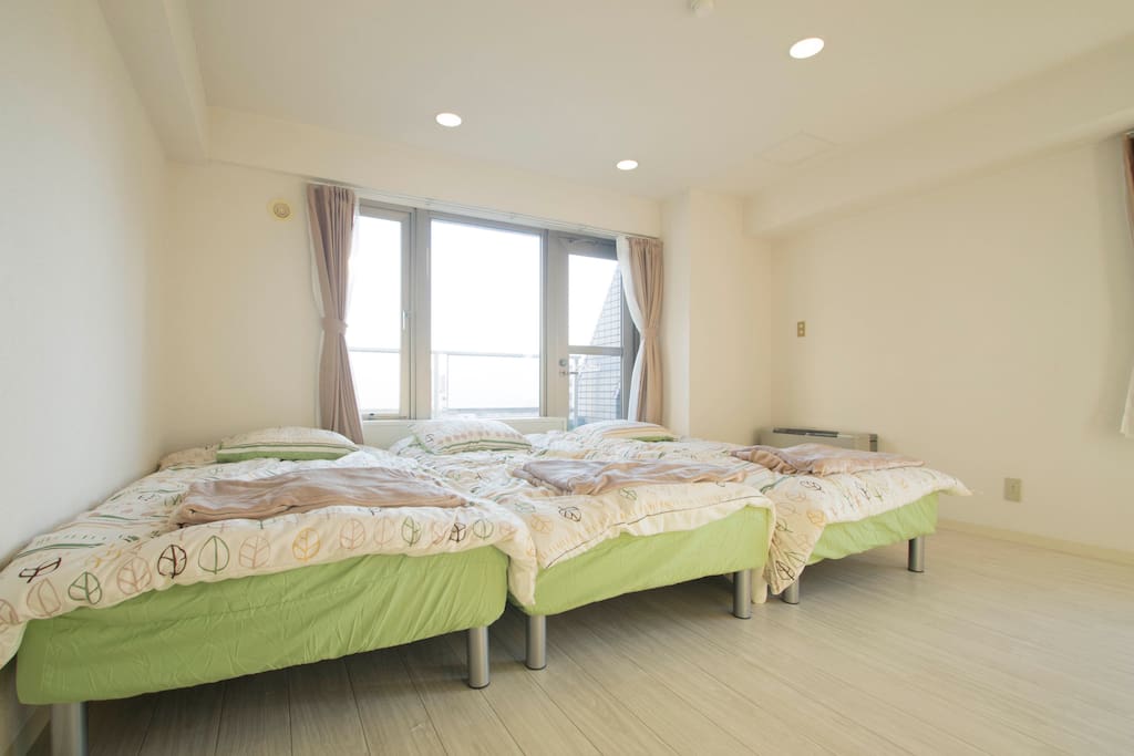 3 single beds in spacious bedroom