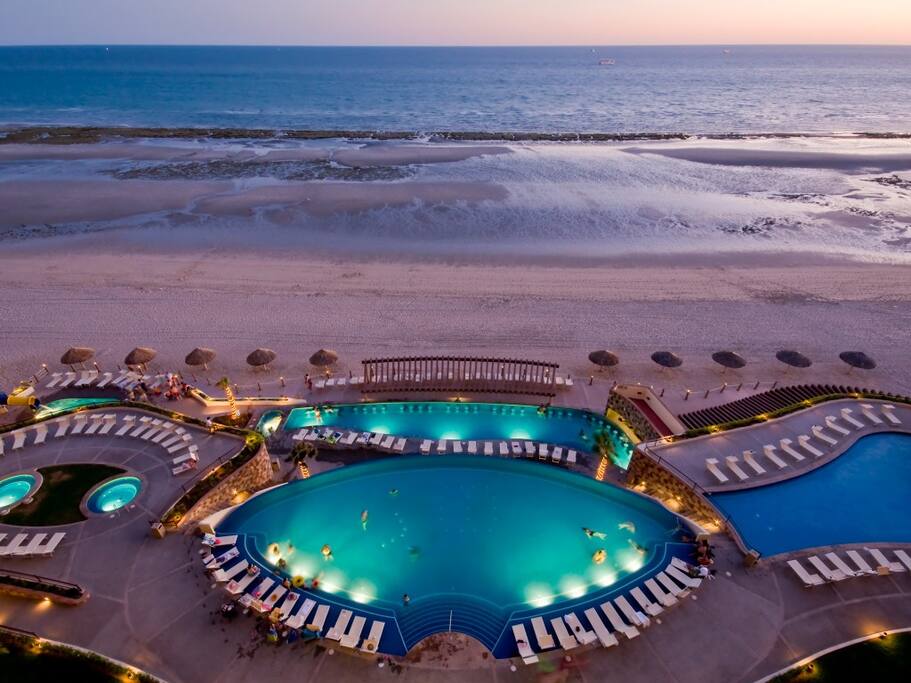 Beautiful pools, hot-tubs at night.