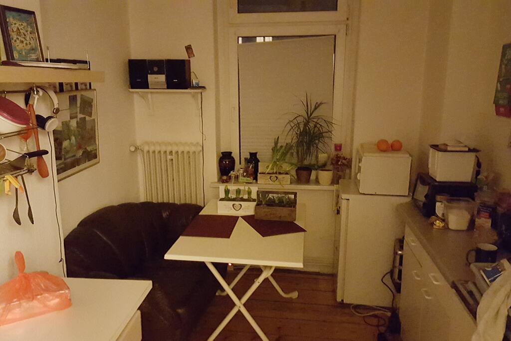 kitchen with fridge, microwelle and equippment