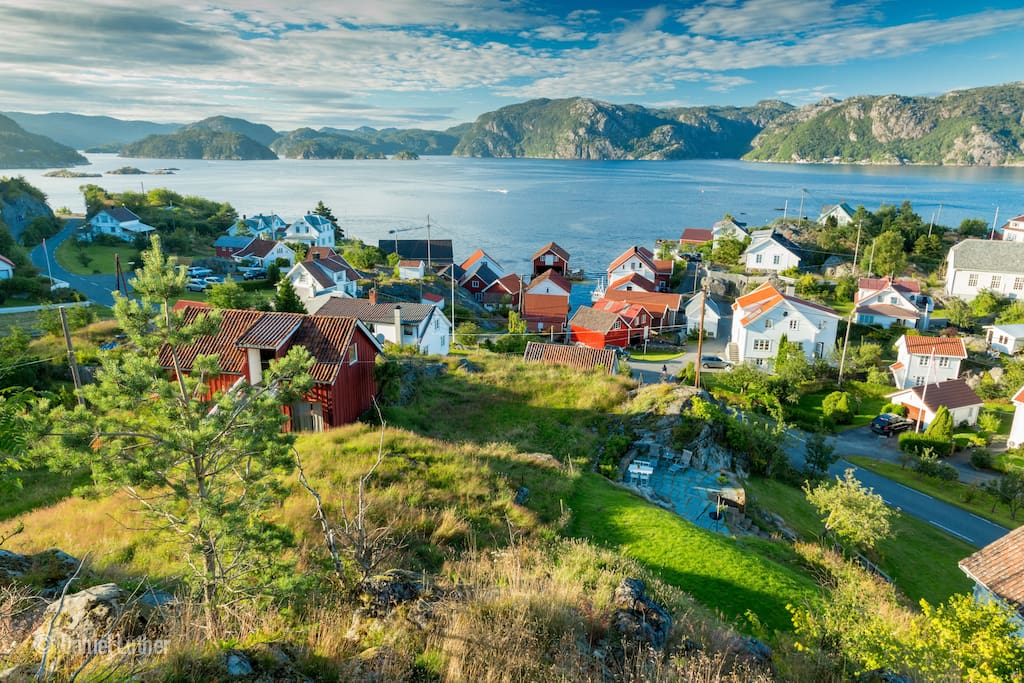View from the top of the hill down on the house and the little boathouses.