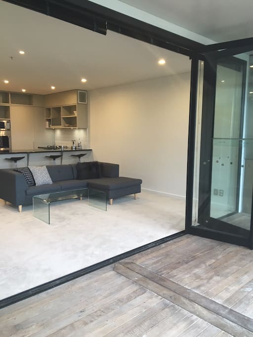 Big bifold doors open to Harbour views