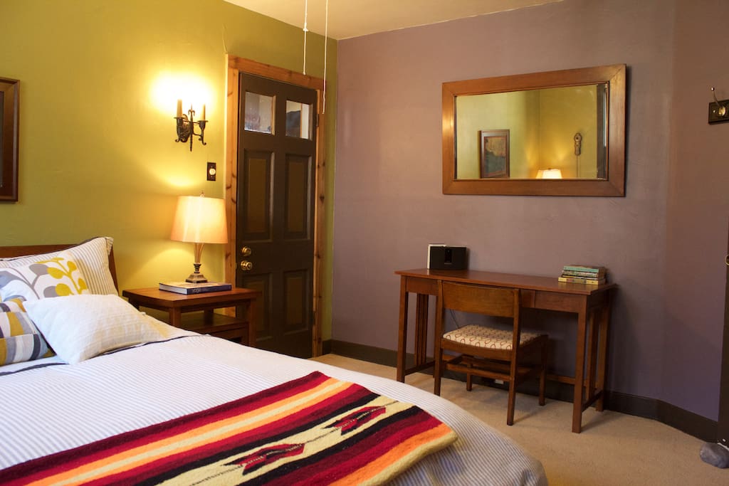 Big mirror, desk and small portable bose speaker to plug in your mobile devices for bedroom disco music parties.