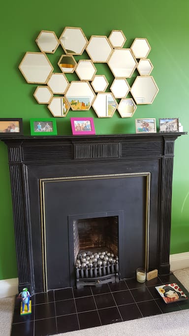 Our fire is just for show but the fairy lights make it cosy