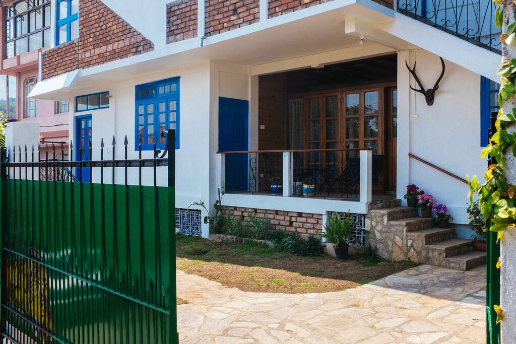 Front of our house - the blue door at the left the Guest Room