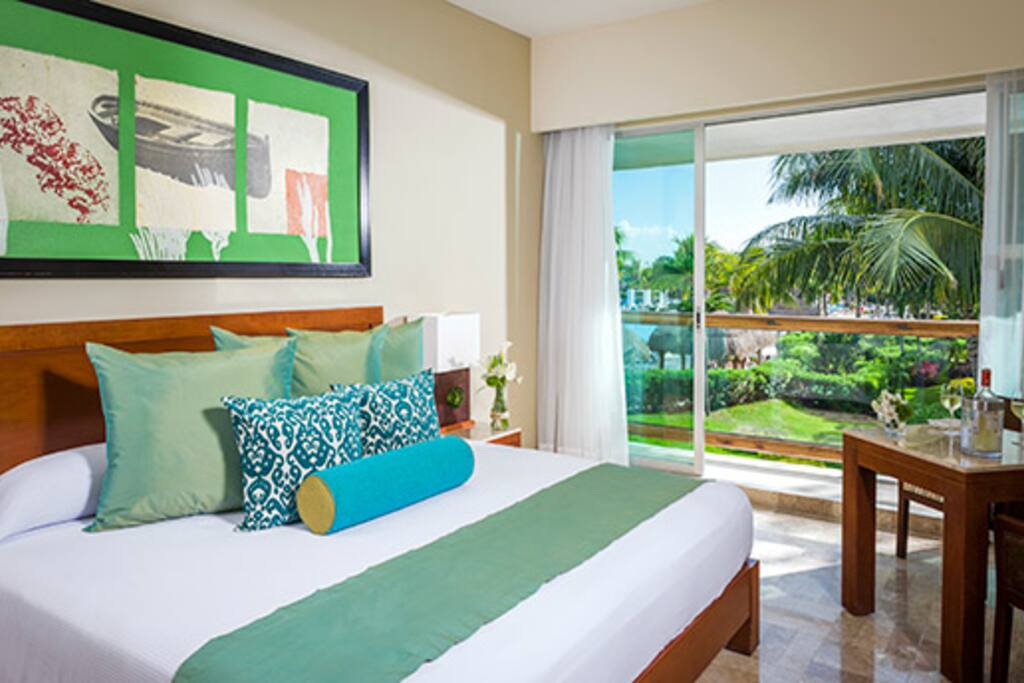 Master Room with sliding doors leading out to the patio. Can request a king bed or two full beds.
