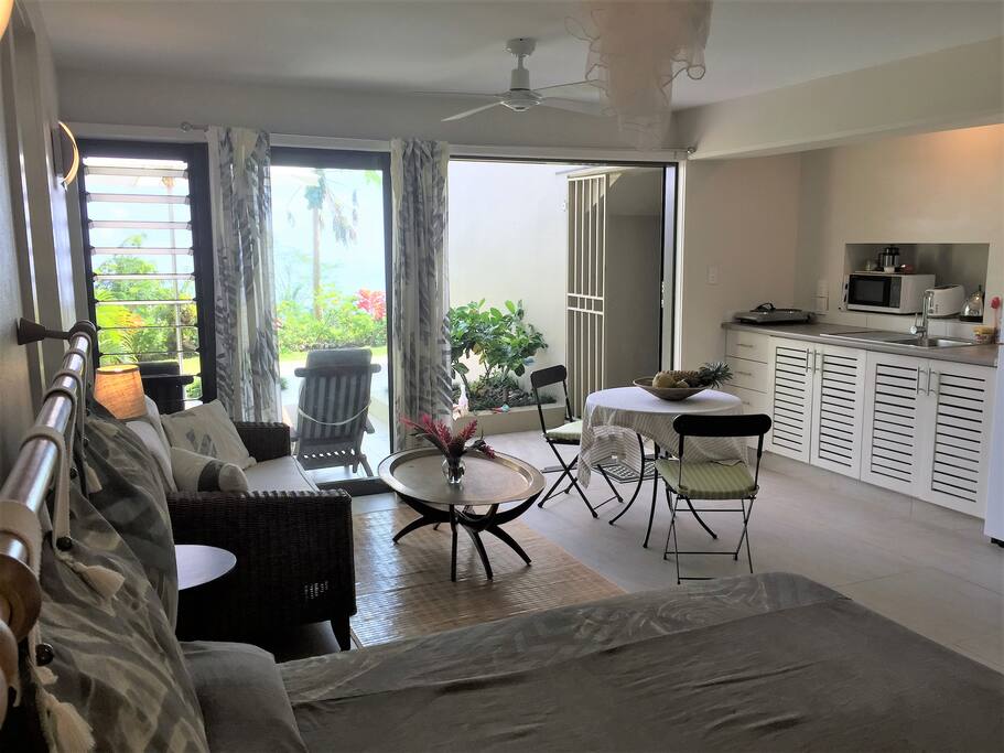 Light-filled space with a view out to the patio and the ocean beyond