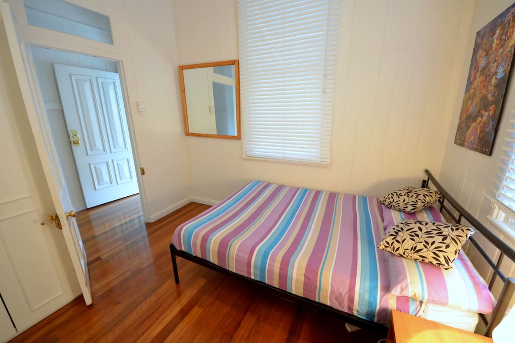 Room is positioned away from bathroom and kitchen close to the front of the house.