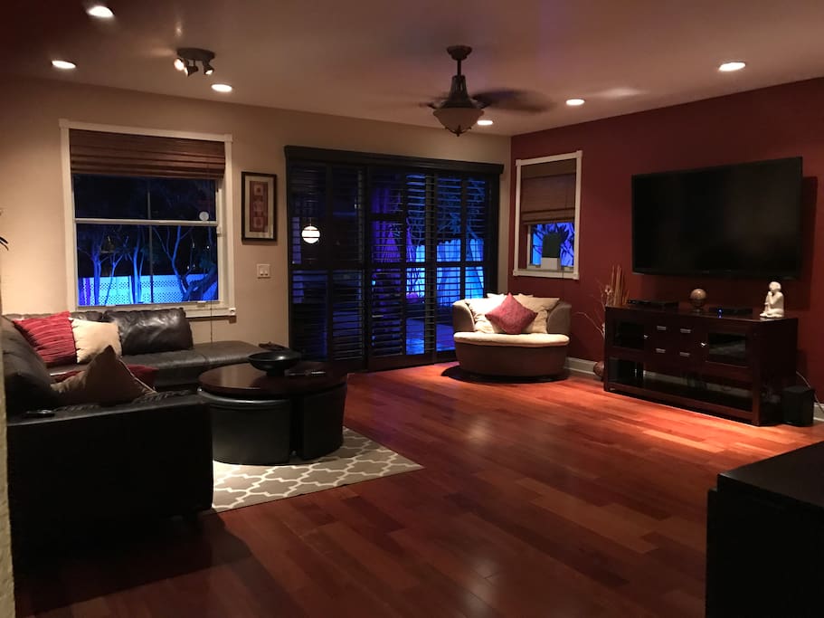 Living Room which leads to outdoor oasis including lanai, pool and gazebo