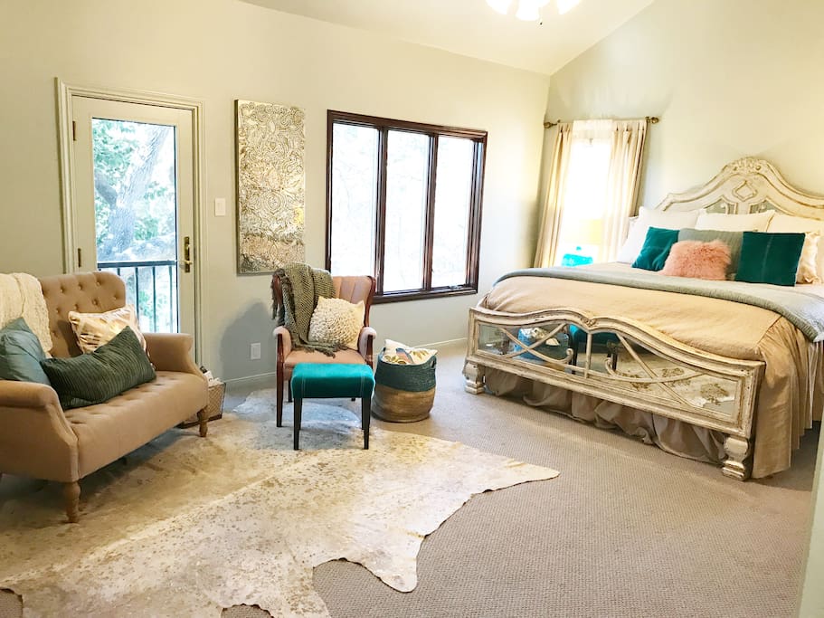Perched on the second floor among the oak trees, our master bedroom features a king size bed, a cozy reading area.