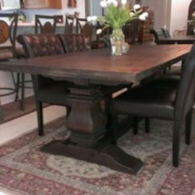 We love this Restoration Hardware dining table and leather chairs.