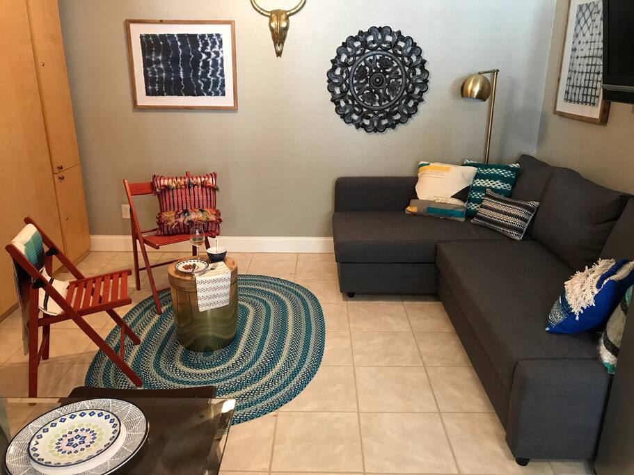 Living room set up with Murphy bed put up.