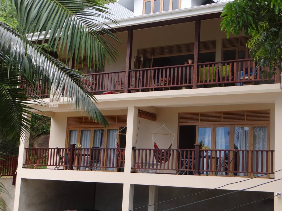 The house: the owner lives on the top floor, 2 studio apartments ("Forest" and "Ocean") are on the first floor and open garage on the ground level