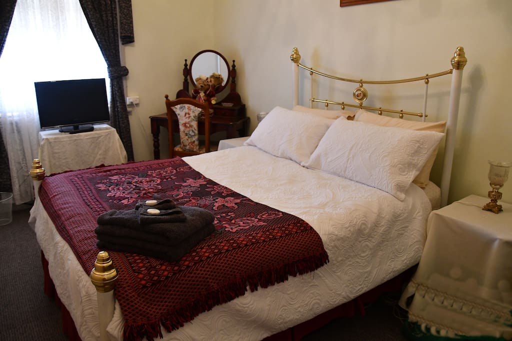 Room 4 is in the main house and next to the bathroom, it has a double bed, electric blanket, ducted cooling, a dressing tale with chair and a small T.V.