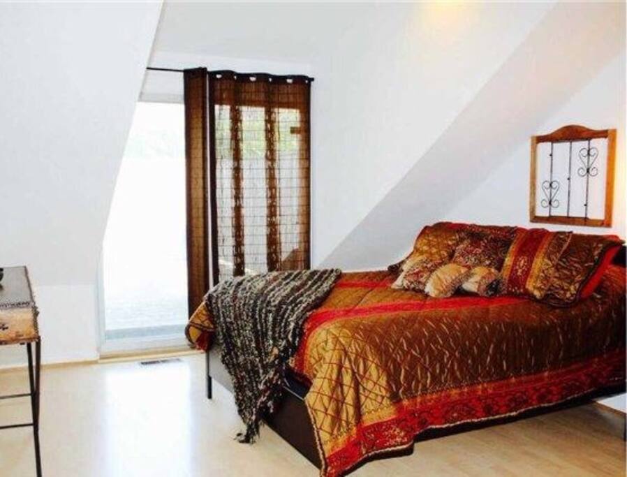 Bedroom with exit to private upper deck
