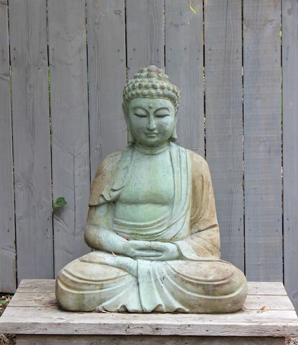 A buddha greets you when you walk into the yard