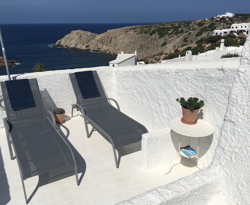 Sun loungers on roof terrace
