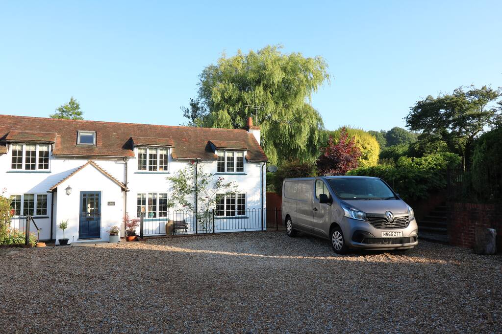 Front of house with large parking