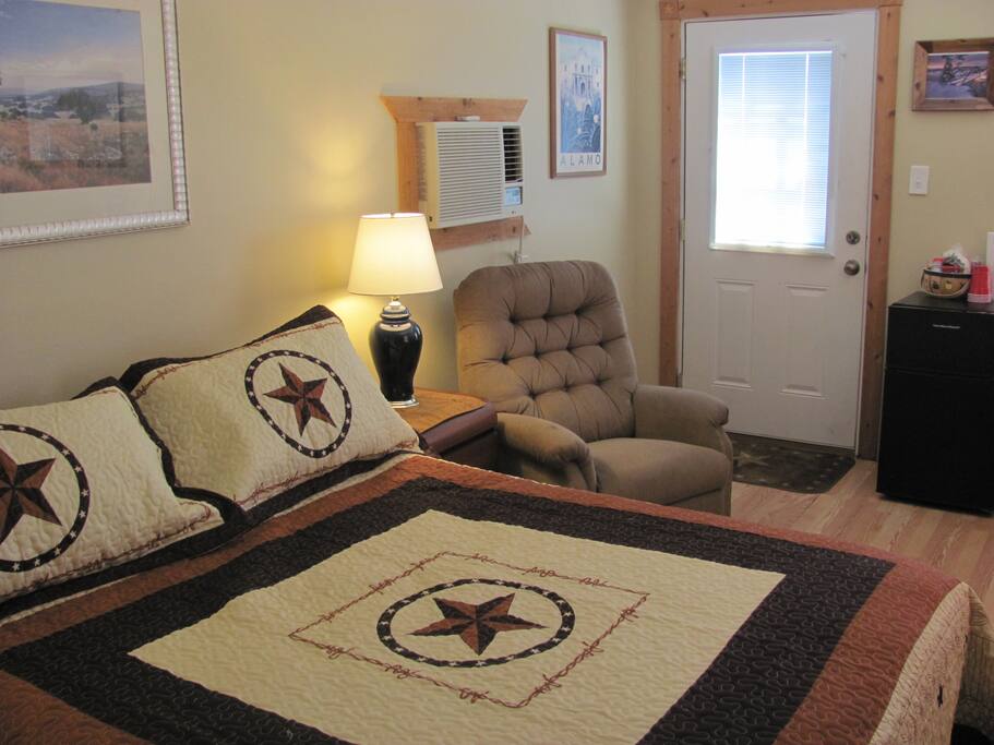 Recliner, small Refrigerator / Freezer, coffee maker, Microwave, and combination A/C & Heater unit.