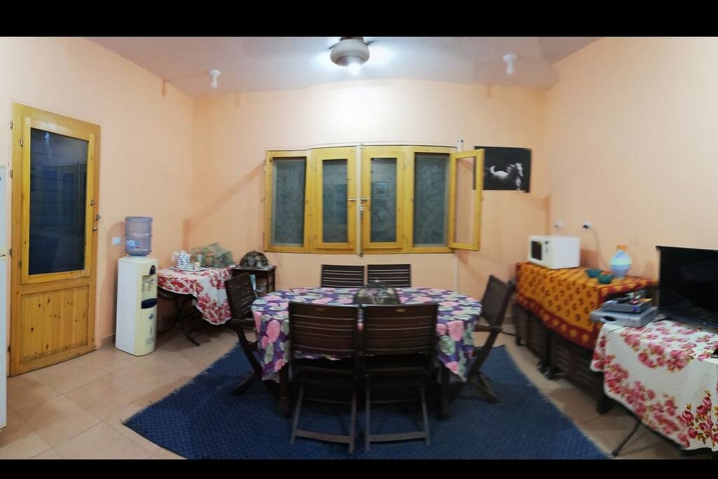 Part of the living area with the dining area and the TV