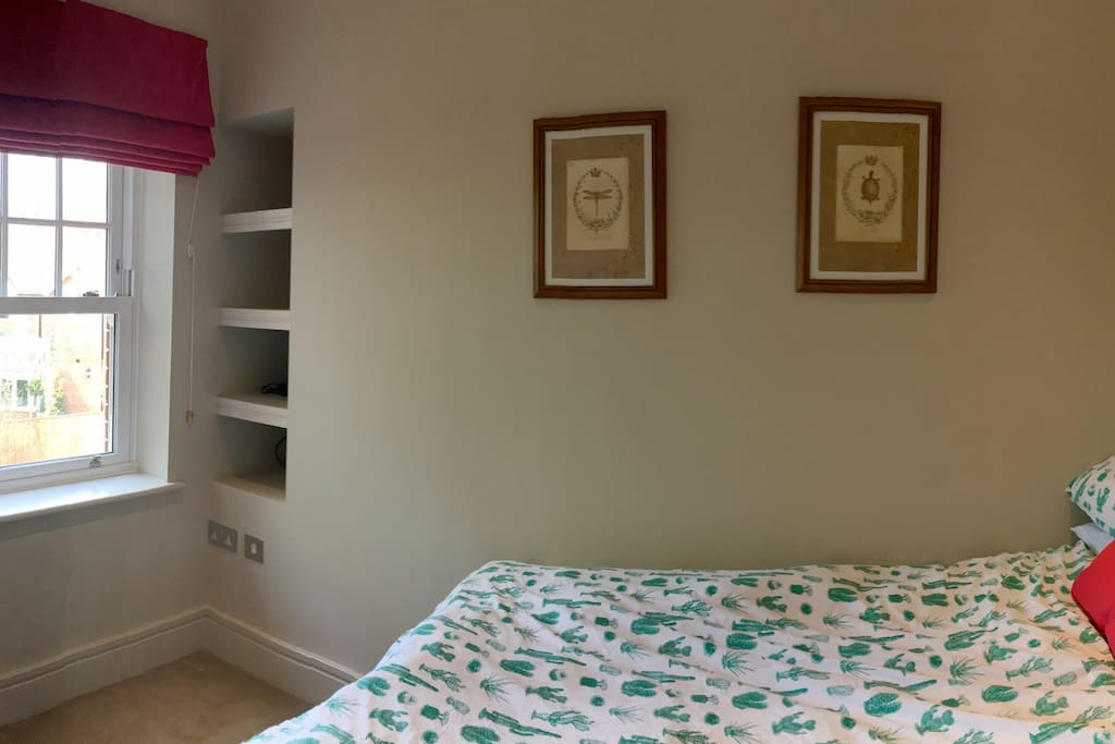 Your Bedroom showing shelving unit and view from windows