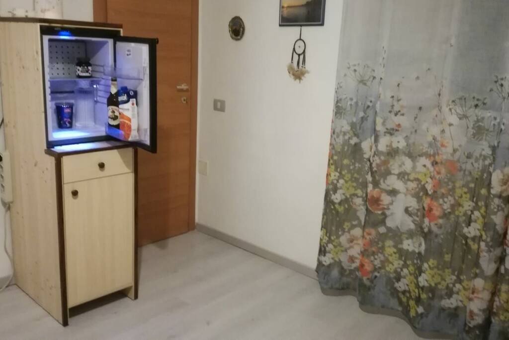 Private mini-fridge in bedroom