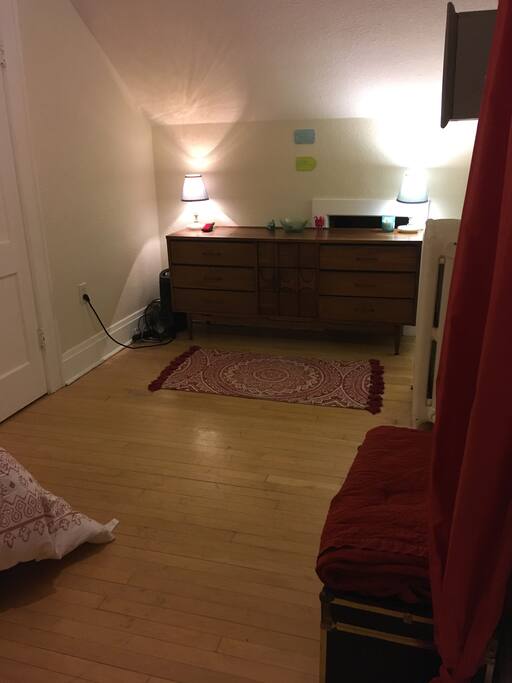 Bedroom with dresser, writing pad, sewing kit and plenty of space for two! (Night view)