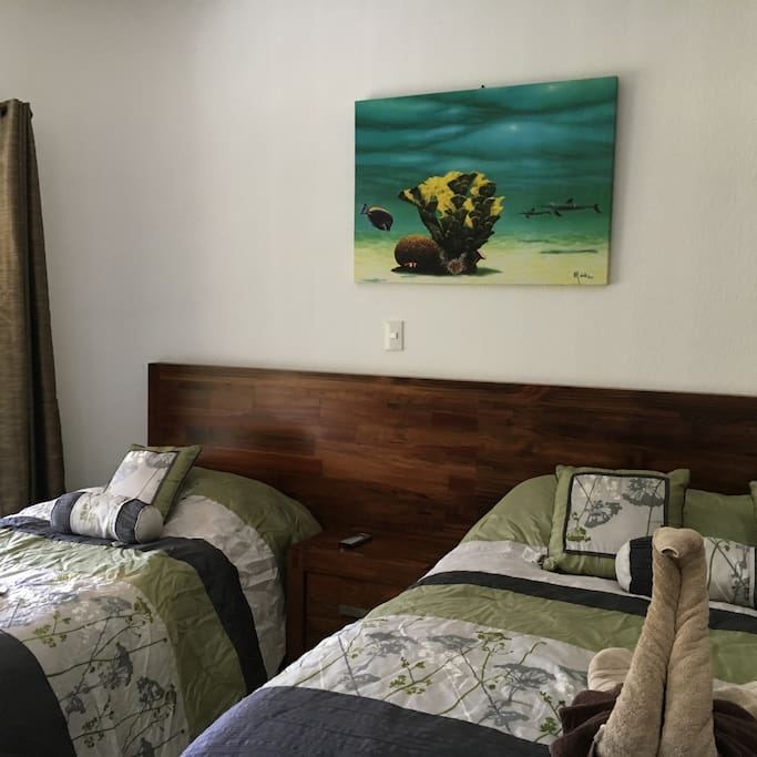 Single and double bed in guest bedroom