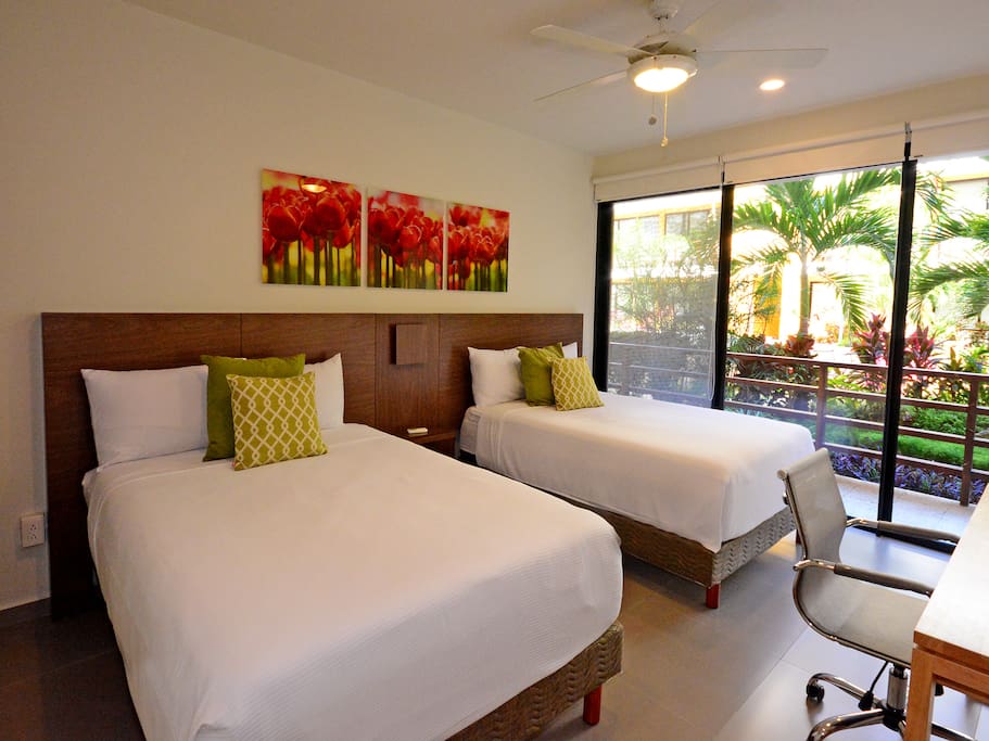 This bedroom has a desk and work area, and walking closet!