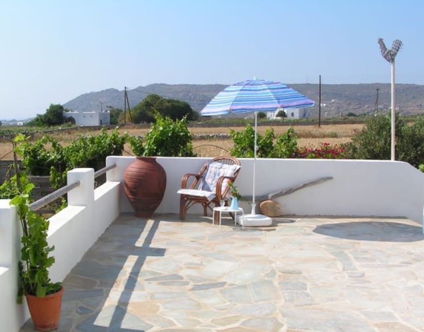The wide balcony is like an outside extension of the sitting room in summer