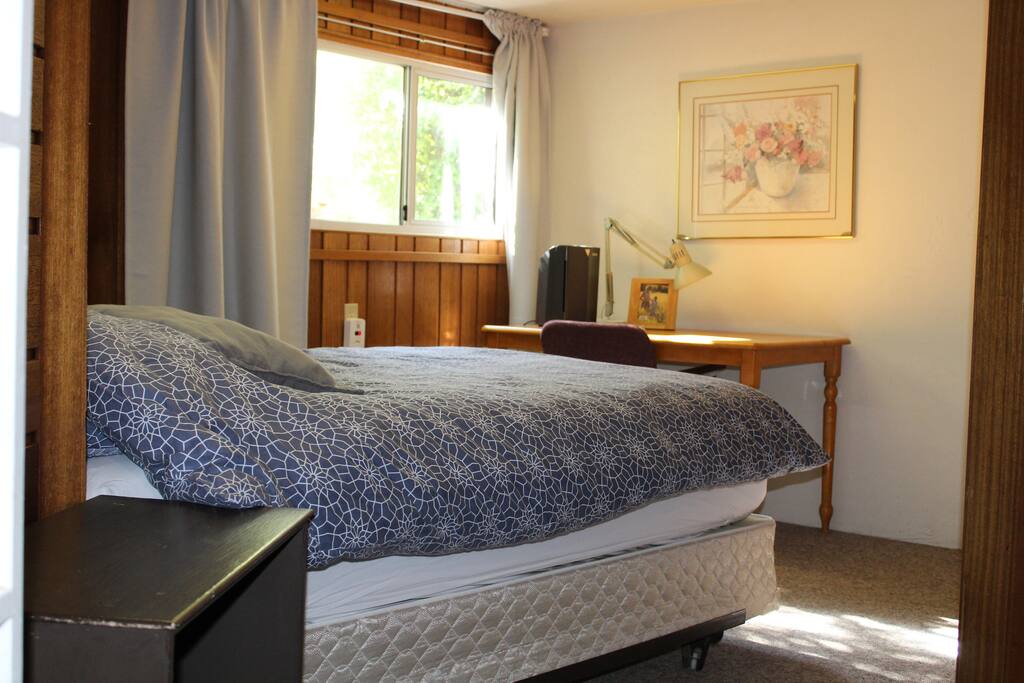 spacious 1st bedroom with extra space for desk and chair