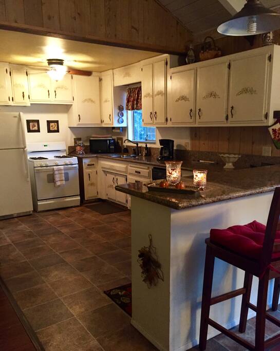 Large fully equipped kitchen off family room.