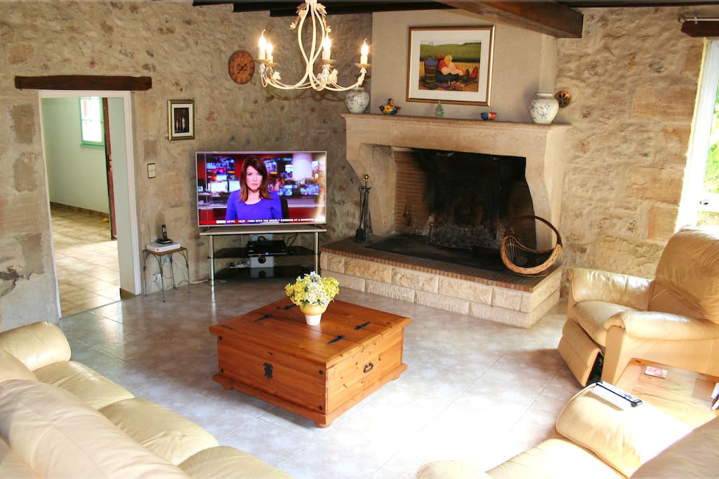 Lovely 11m x 5m Lounge. Leather suite, Open Stone fireplace, 55-inch LED HD TV with FreeSAT HD and Blu-ray. DVD/BR collection of around 100 of top movies for grown-up and kids.