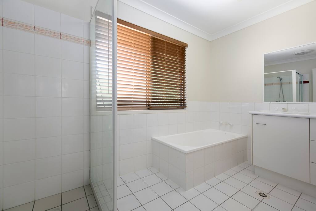 The upstairs bathroom has a bath and shower - it is next to the 1st bedroom.