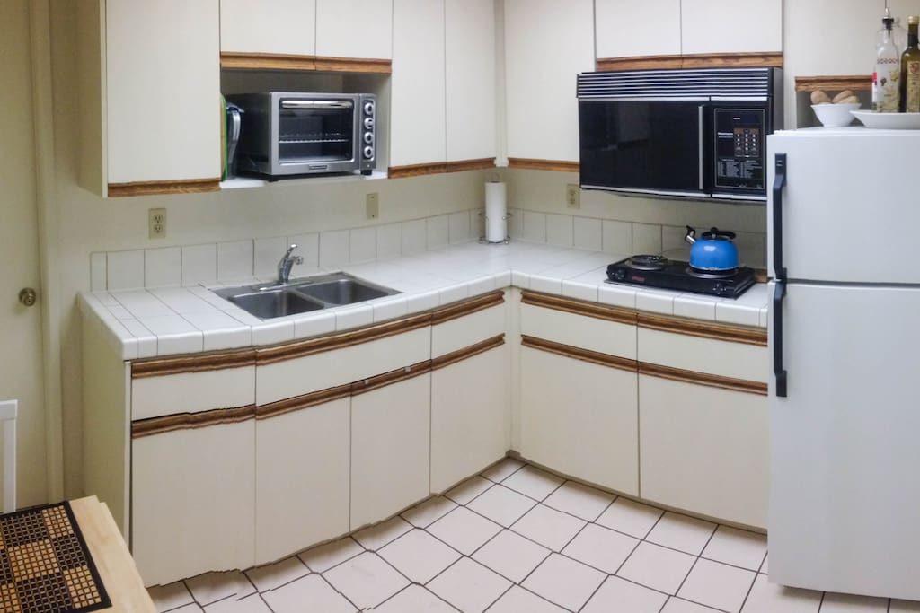 Kitchen includes convection oven and crockpot; along with microwave oven.
