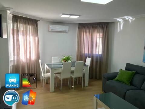 Modern apartment with AC and garage in building.