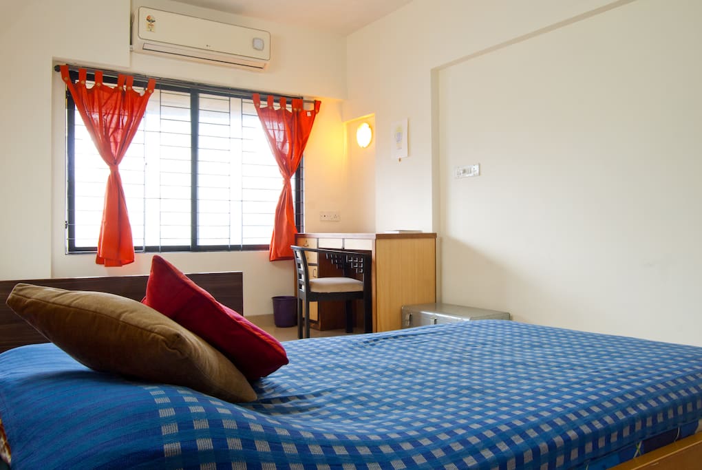 Windows light up the bedroom during the day