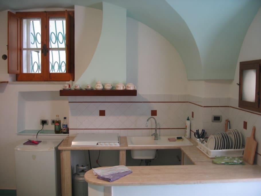 The kitchen. It is well equipped, all ready to cook your favourite dishes.