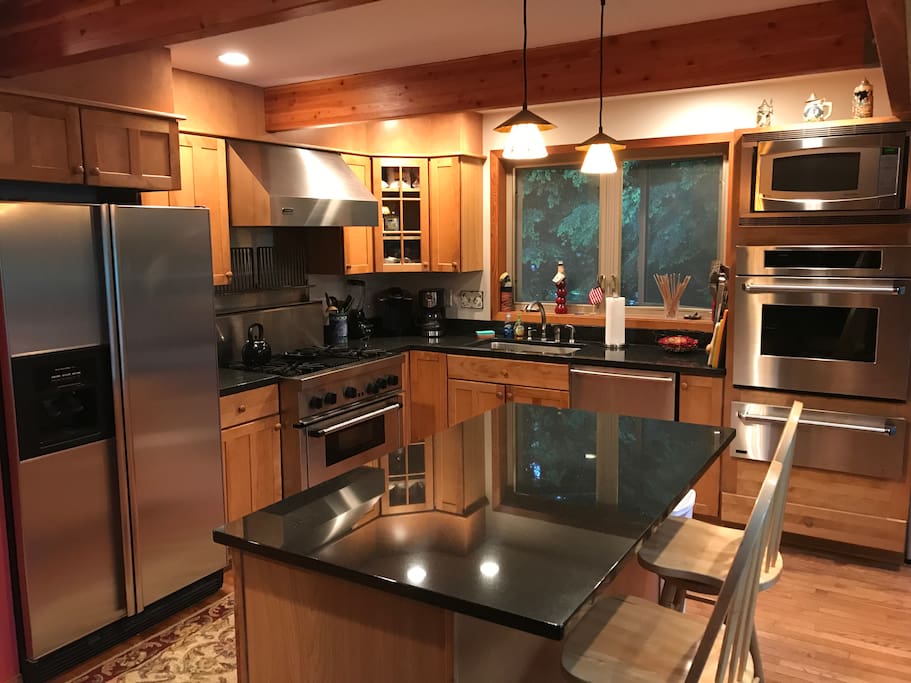 Gourmet Kitchen with professional appliances and granite counter tops.