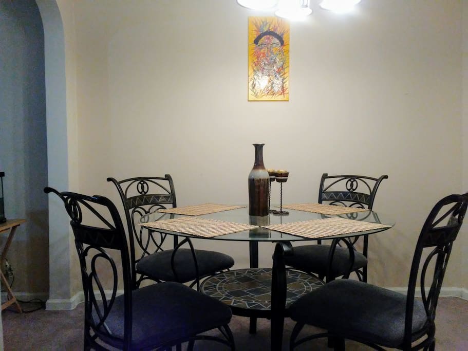 Our dinning table comfortably fits four. Other chairs are available to add to the table if needed.