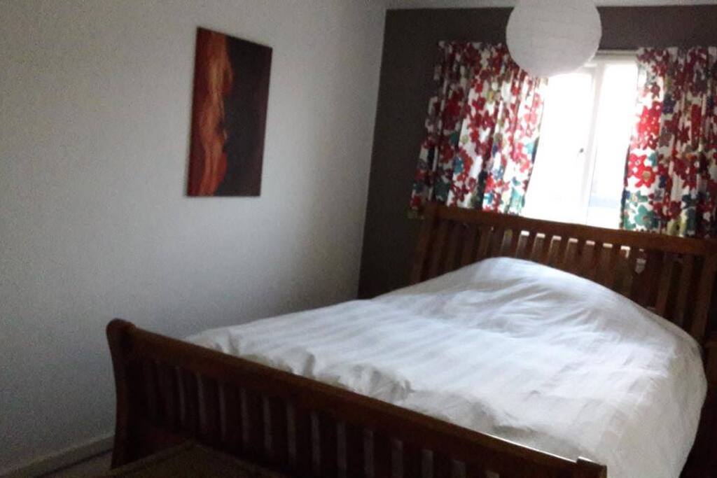 Bedroom 1 with double bed and wardrobe/ shelf space