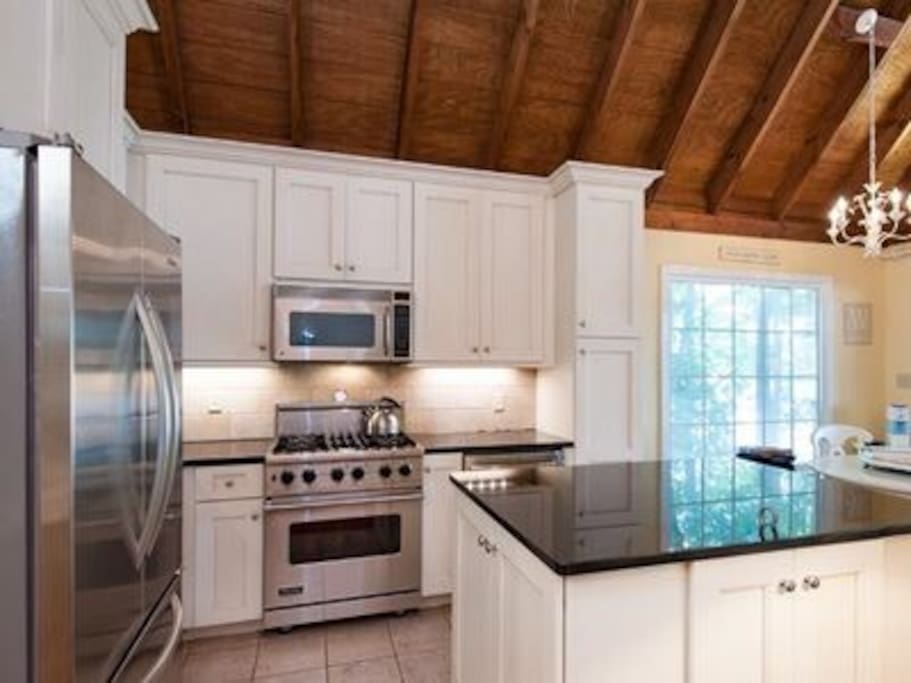 Enjoy this beautiful gourmet kitchen with a Viking gas range!