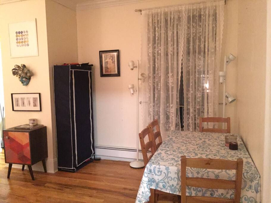 Dinning table in the living room sits 4 people