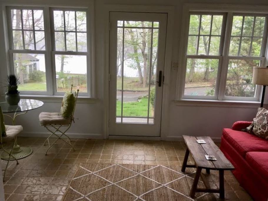 Sunroom with view of pond