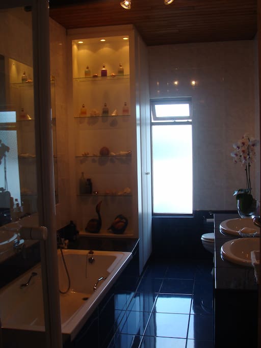 Your private bathroom which is not en suite. There is a good strong shower with plenty of hot water and a bath with hand shower.