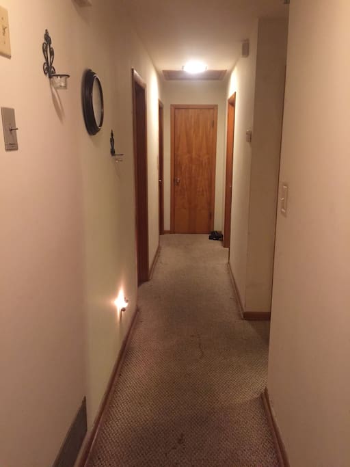 Hallway to the bathroom, 1st door on right hand side.