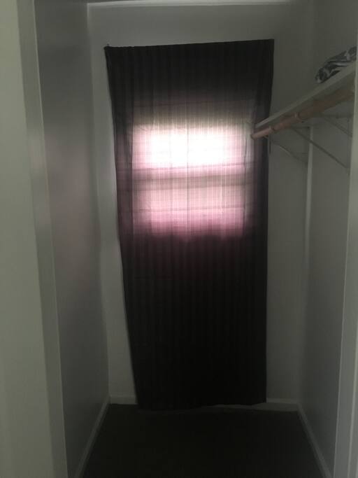 Walk in closet with plenty of room for clothes and storage.