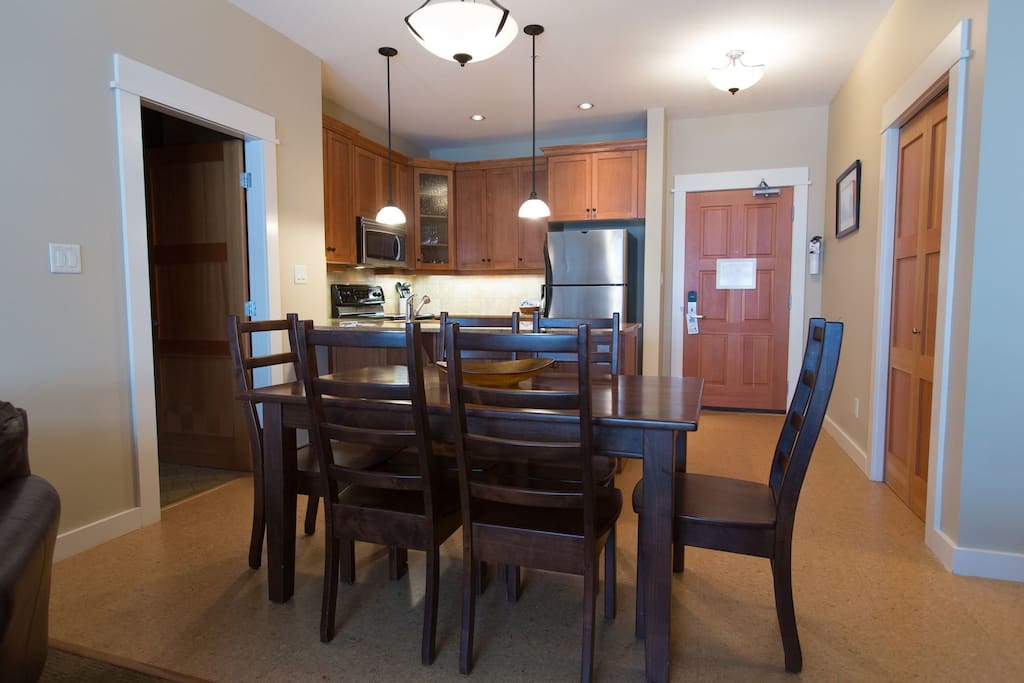 Enjoy meals together at the large wooden dining table