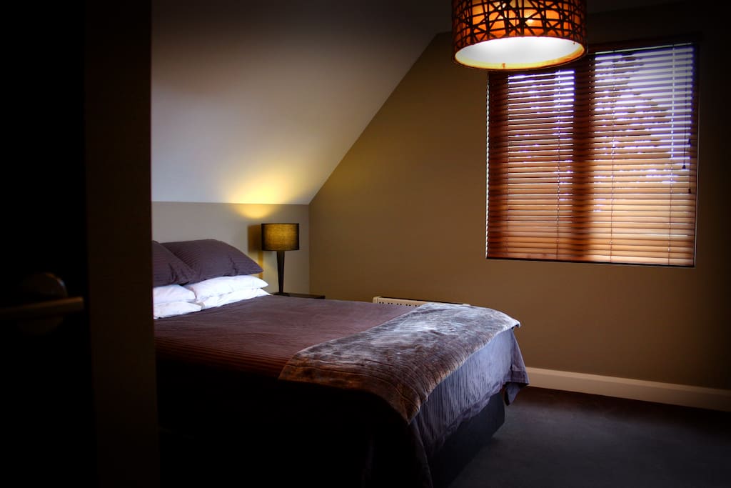 Guest bedroom. The television is in the built-in cupboard.