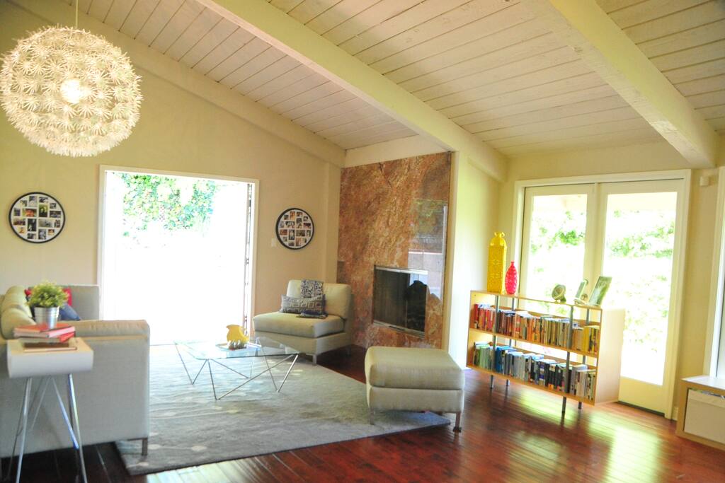 Living room opens to backyard and faces mountain views