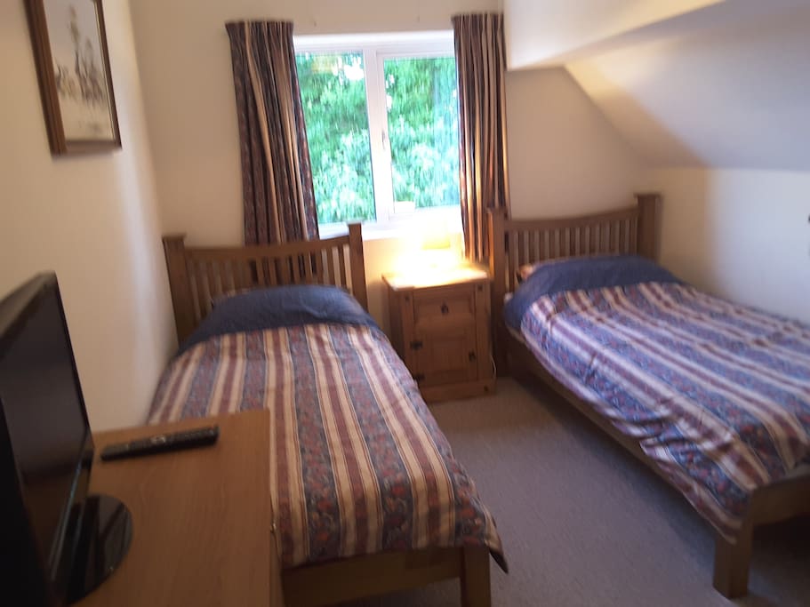 Comfortable twin bedded room with TV and Wifi